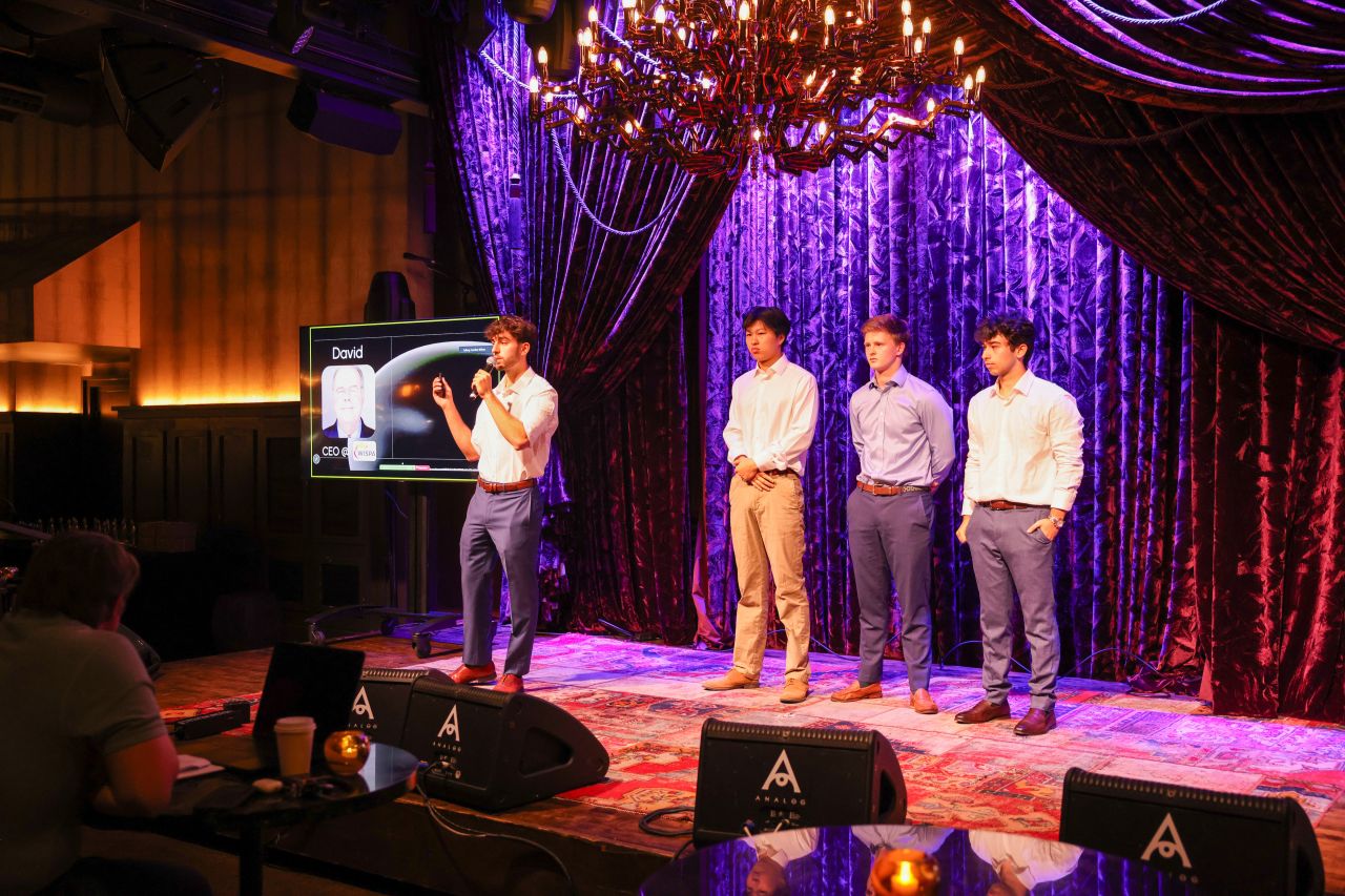 KTP team pitching on stage at the Dry Dock Venture Studio Hackathon